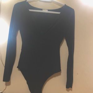 Black bodysuit with v line and metal buttons